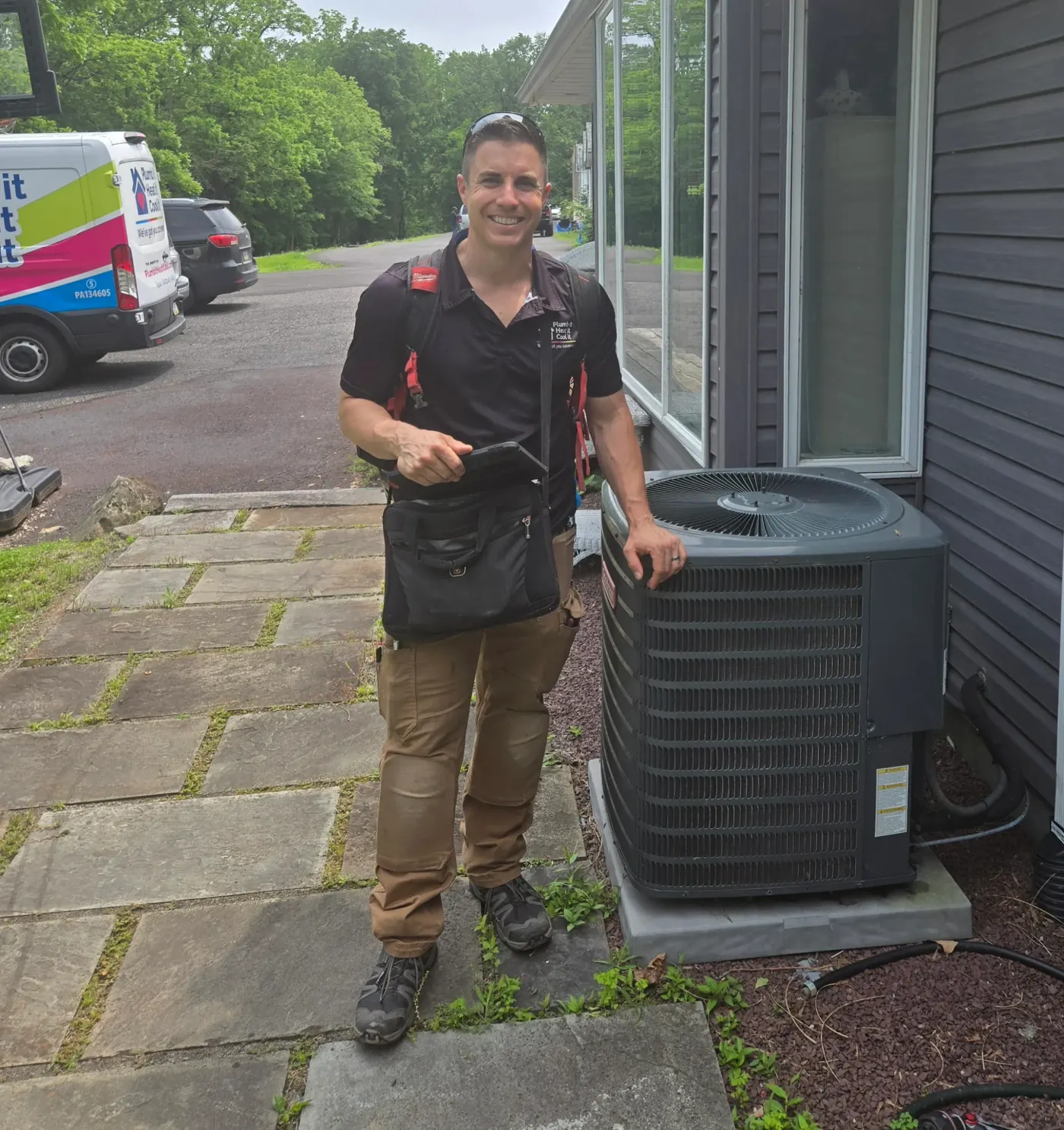 Licensed HVAC technician performing a system tune-up